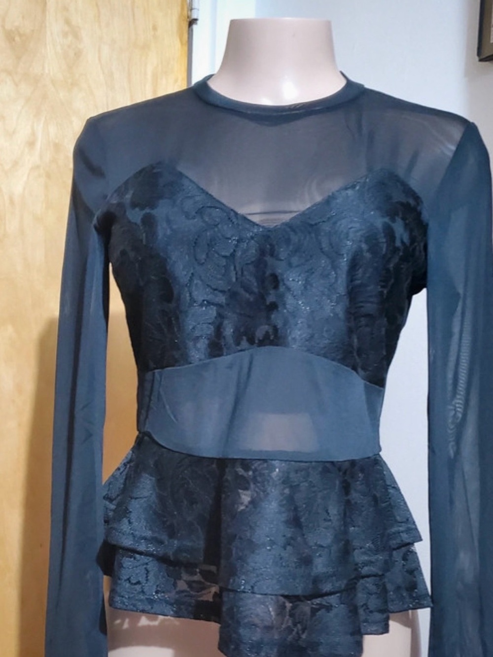 Sheer Long Sleeve Peplum Top in Black